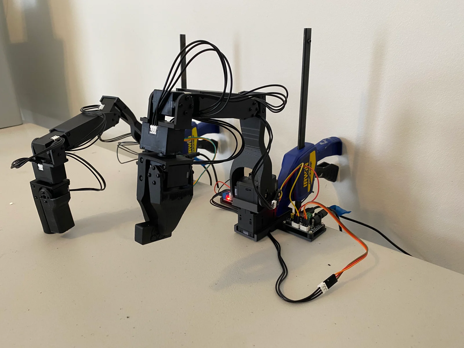 Koch v1.1 leader and follower arms on a desk with cabling