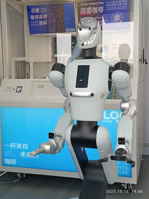 Galbot G1 wheeled humanoid working inside a Galbot store kiosk, Shenzhen